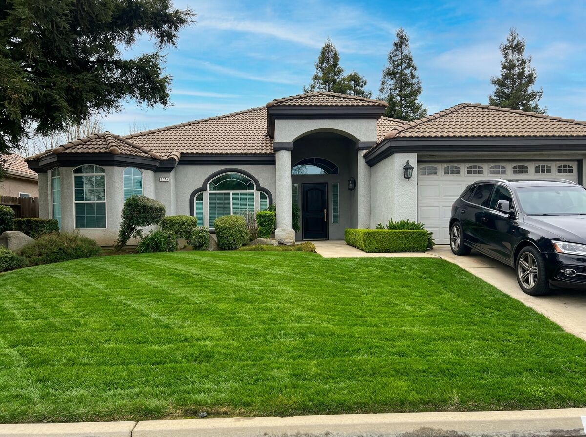 Beautifully striped Mediterranean style home lawn in Clovis